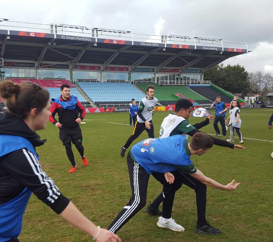 Young people playing rugby